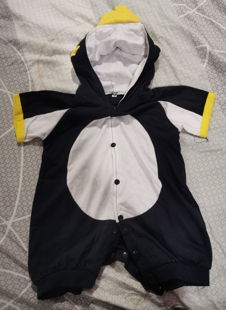 Baby Penguin Onesie (Category: Babies & Kids Fashion) located in Quezon City. Submitted by declutteringmami (Listing ID 1404572774, Image 1). Description: - Adorable penguin onesie for babies. - Features a black and white body. - White belly and black sleeves. - Hood with a yellow beak. - Yellow cuffs on the sleeves. - Convenient snap closures down the front. - used once - 9-12 months.