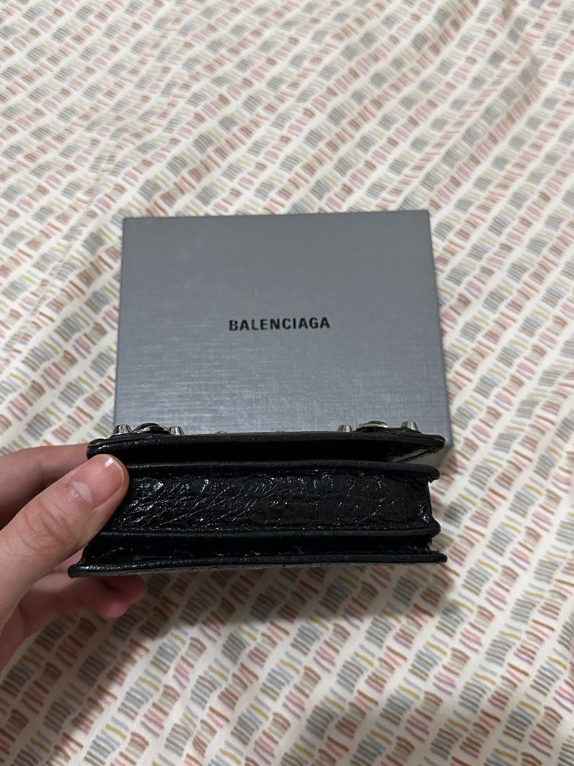 Balenciaga Classic City Wallet (Category: Luxury Bags & Wallets) located in Manila. Submitted by biancamarie03 (Listing ID 1404529985, Image 2). Description: - Balenciaga Classic City wallet - Black color - Zip closure - Snap closure - Multiple card slots - Textured leather finish - Silver-tone hardware - Includes original box.