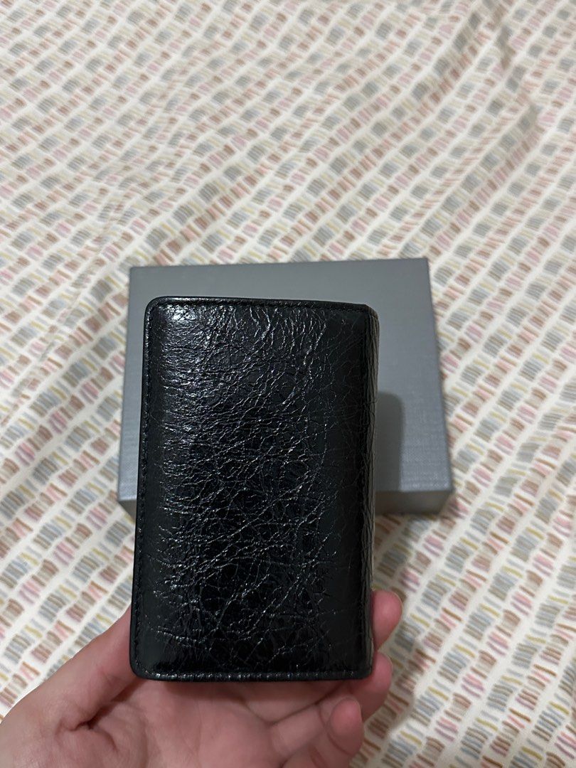 Balenciaga Classic City Wallet (Category: Luxury Bags & Wallets) located in Manila. Submitted by biancamarie03 (Listing ID 1404529985, Image 3). Description: - Balenciaga Classic City wallet - Black color - Zip closure - Snap closure - Multiple card slots - Textured leather finish - Silver-tone hardware - Includes original box.