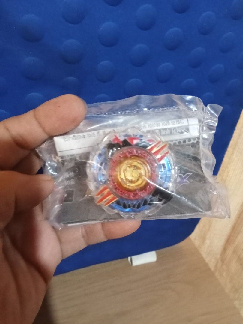 Beyblade Burst Evolution (Category: Action & Battle Toys) located in Bocaue. Submitted by marajapansurplus (Listing ID 1404382607, Image 2). Description: - Brand new, sealed Beyblade Burst Evolution set. - Comes with all original packaging, instructions, and stickers. - Features a vibrant blue, red, and orange color scheme. - Includes a launcher string. - Ready for immediate battle!.