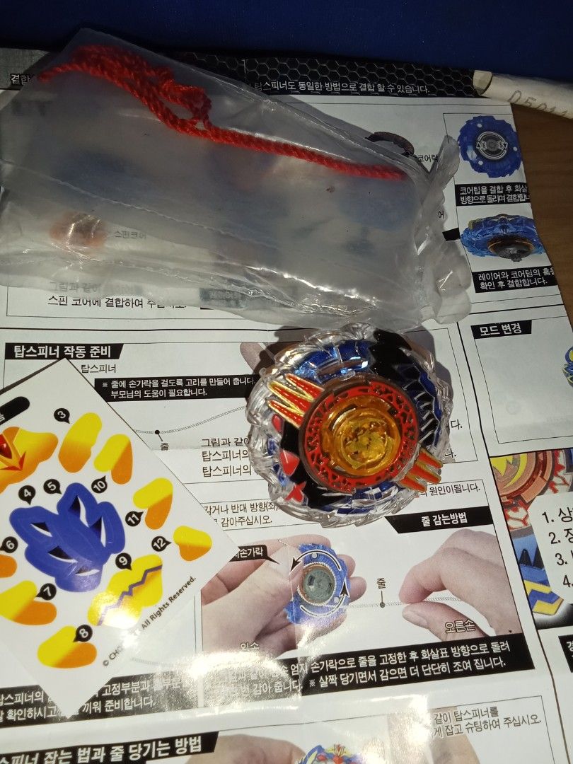 Beyblade Burst Evolution (Category: Action & Battle Toys) located in Bocaue. Submitted by marajapansurplus (Listing ID 1404382607, Image 3). Description: - Brand new, sealed Beyblade Burst Evolution set. - Comes with all original packaging, instructions, and stickers. - Features a vibrant blue, red, and orange color scheme. - Includes a launcher string. - Ready for immediate battle!.