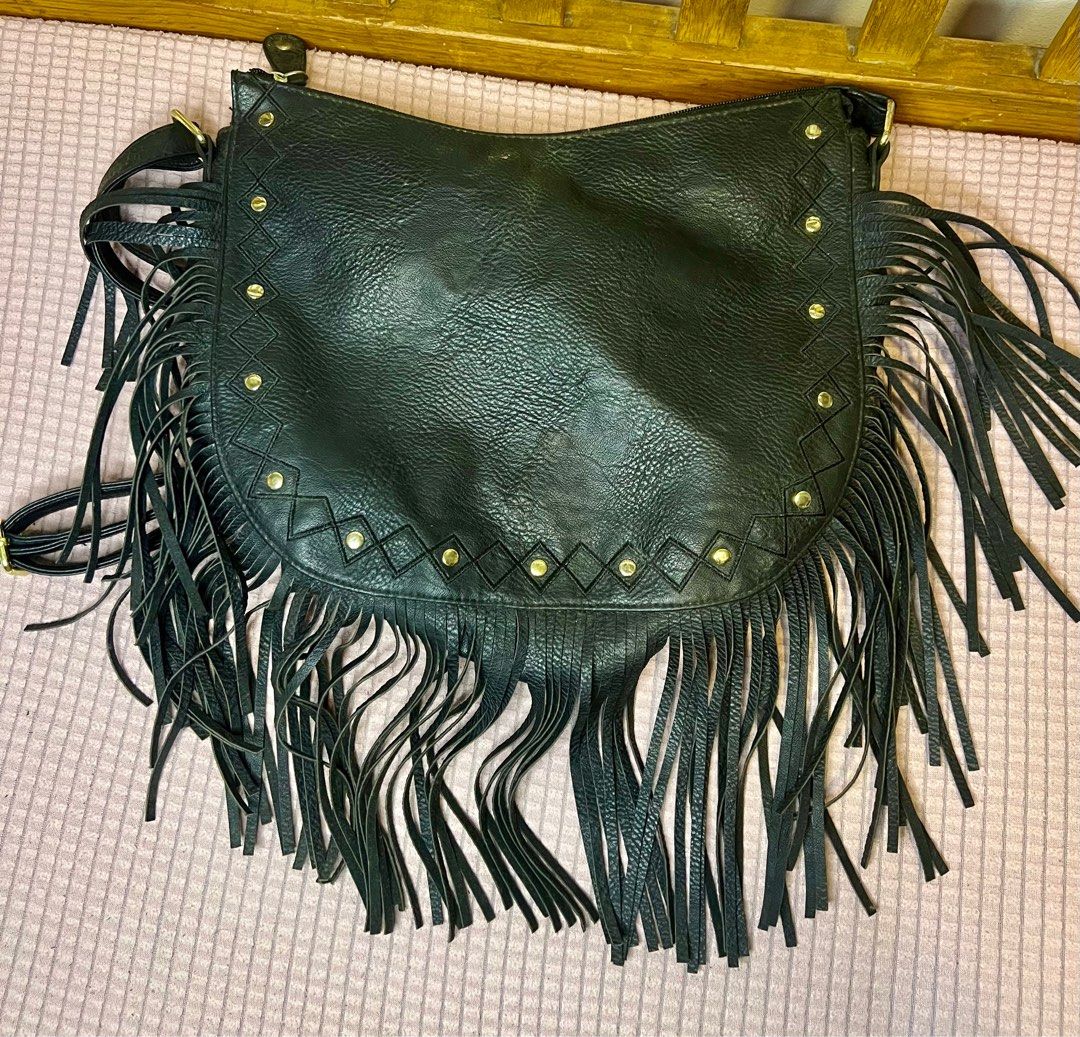 Black Fringe Crossbody Bag (Category: Cross-body Bags) located in Antipolo. Submitted by love_misspetals (Listing ID 1404481787, Image 1). Description: - Black crossbody bag - Features fringe detailing - Adjustable long strap - Gold-colored stud accents - Flap closure - Made of leather-like material - Perfect for a bohemian look.
