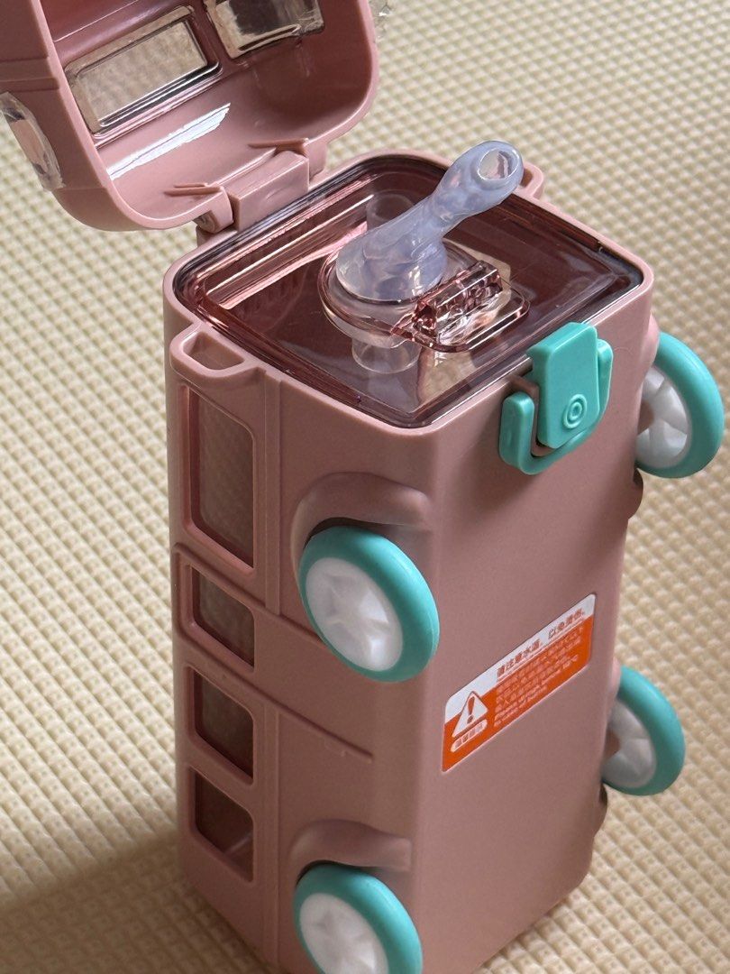 Bus-Shaped Water Bottle with Strap (Category: Water Bottles & Tumblers) located in Manila. Submitted by bearswardrobe (Listing ID 1404415973, Image 2). Description: 500 ml kid water bottle with strap. Color: Pink.