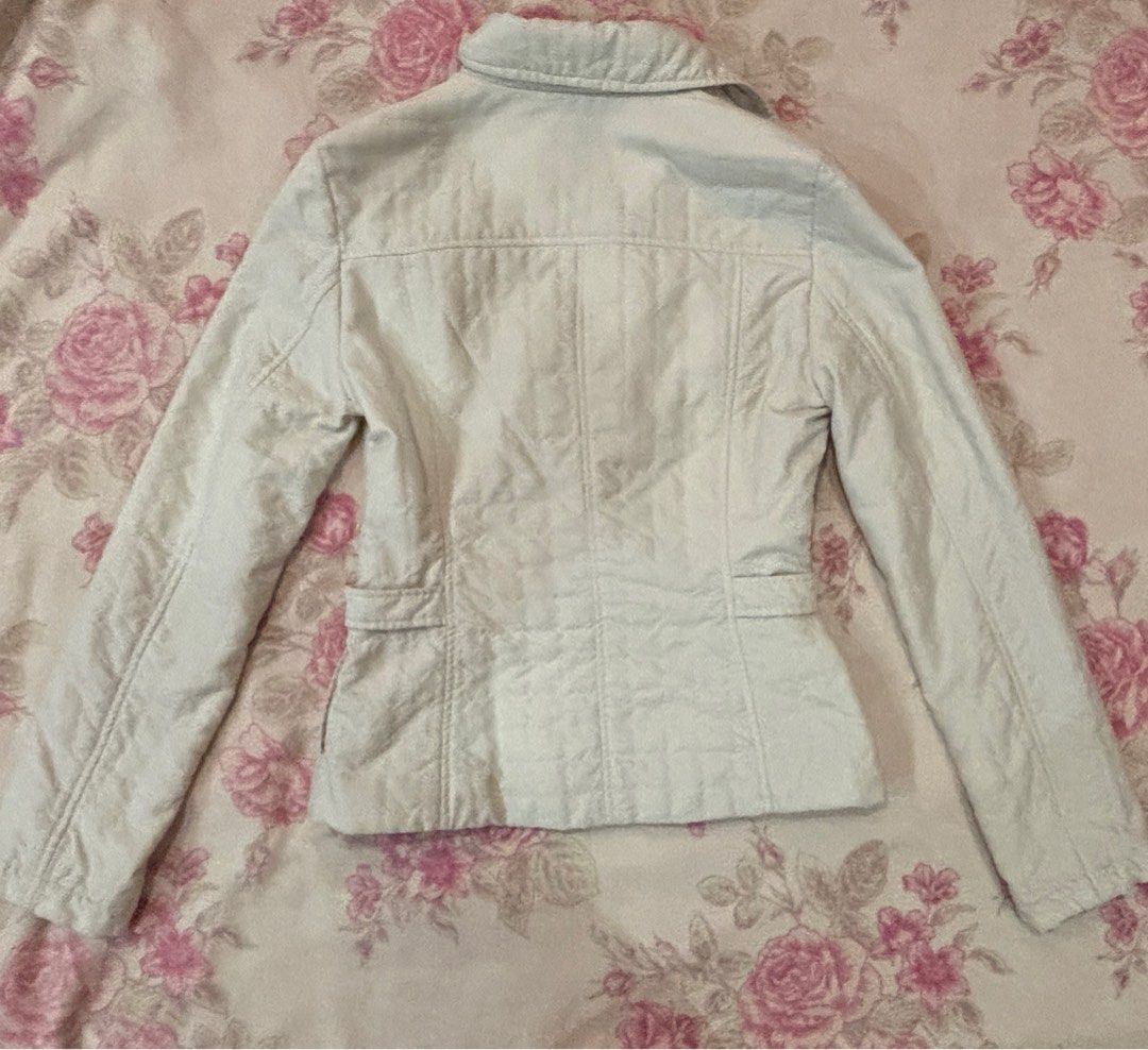 CdeC Beige Jacket (Category: Coats, Jackets and Outerwear) located in Kuala Lumpur. Submitted by emimies (Listing ID 1404472933, Image 2). Description: - CdeC Beige Jacket - Size S - Collared neckline - Button closure - Two front pockets with buckle details - Fitted silhouette - Long sleeves - Quilted back design - Suitable for casual wear.