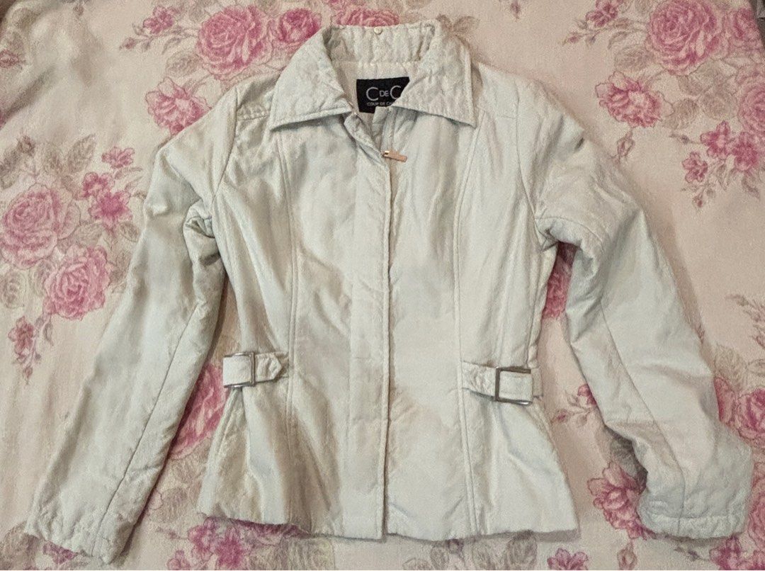 CdeC Beige Jacket (Category: Coats, Jackets and Outerwear) located in Kuala Lumpur. Submitted by emimies (Listing ID 1404472933, Image 1). Description: - CdeC Beige Jacket - Size S - Collared neckline - Button closure - Two front pockets with buckle details - Fitted silhouette - Long sleeves - Quilted back design - Suitable for casual wear.