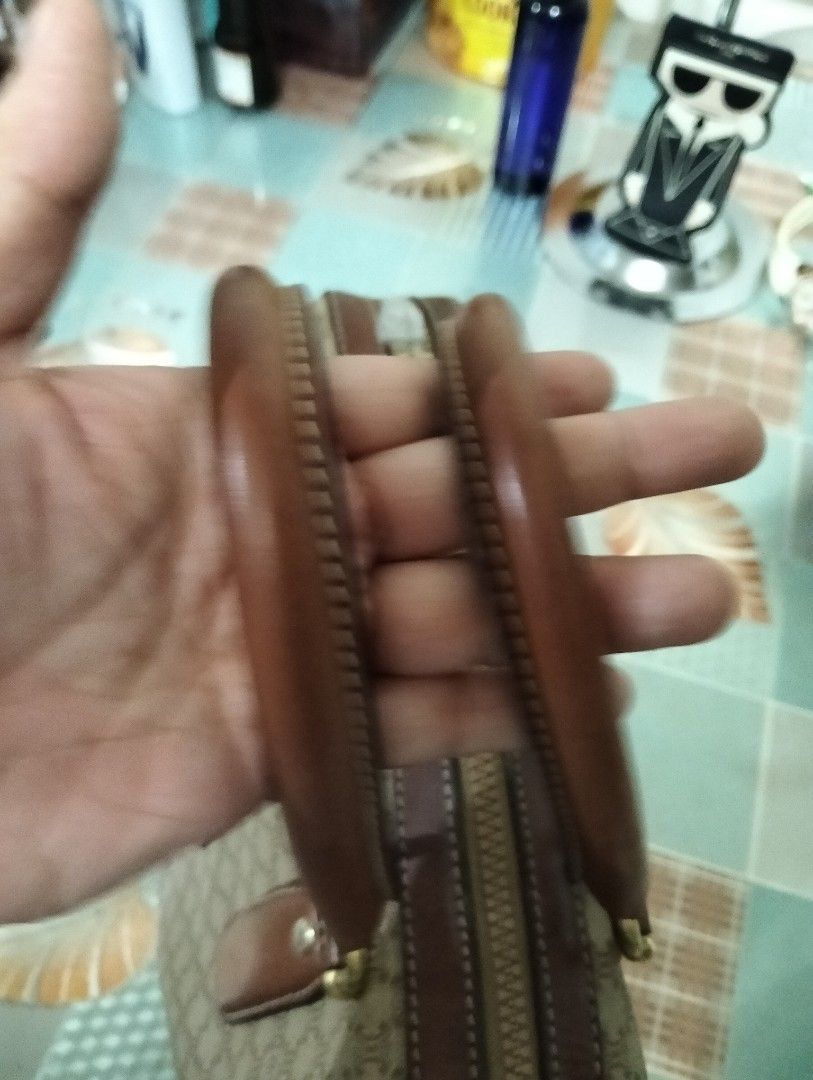 Celine Macadam Handbag (Category: Luxury Bags & Wallets) located in Manila. Submitted by beabi041582 (Listing ID 1404497010, Image 2). Description: dimension 11.5 xl 9, with flaw sa baba ng handles , vintage Pero ok pa yung bag leather may flaw sa handle Pero magagamit patahin mo na lang original to Classic Celine handbag featuring the iconic Macadam pattern. It has brown leather accents on the handles, corners, and trim. The bag has a top zipper
