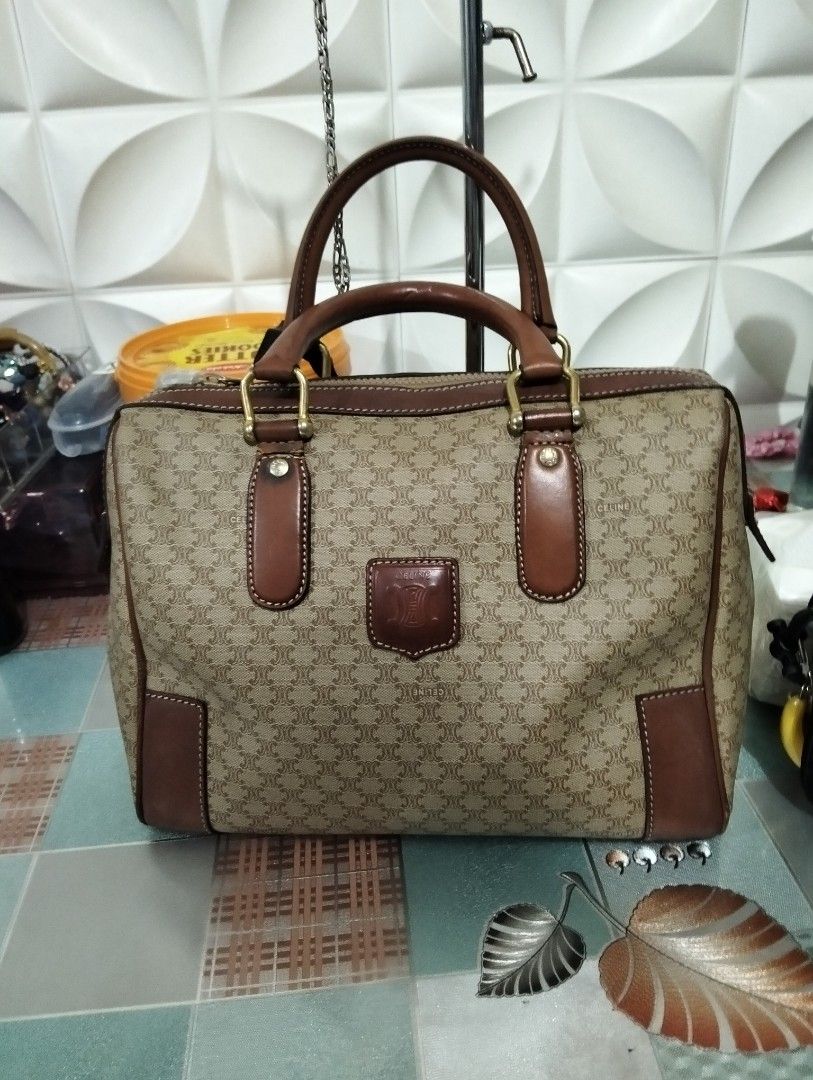 Celine Macadam Handbag (Category: Luxury Bags & Wallets) located in Manila. Submitted by beabi041582 (Listing ID 1404497010, Image 1). Description: dimension 11.5 xl 9, with flaw sa baba ng handles , vintage Pero ok pa yung bag leather may flaw sa handle Pero magagamit patahin mo na lang original to Classic Celine handbag featuring the iconic Macadam pattern. It has brown leather accents on the handles, corners, and trim. The bag has a top zipper