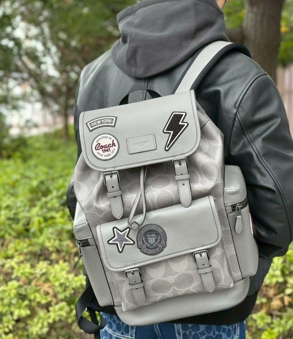 Coach Patchwork Backpack - Grey (Category: Backpacks) located in Singapore. Submitted by joyladder21 (Listing ID 1404381871, Image 4). Description: Stylish Coach backpack in grey with patchwork details. Features multiple compartments and adjustable straps. Perfect for everyday use or travel. Excellent condition, as shown in the photos. Purchased from a Coach outlet. used once like brandnew..