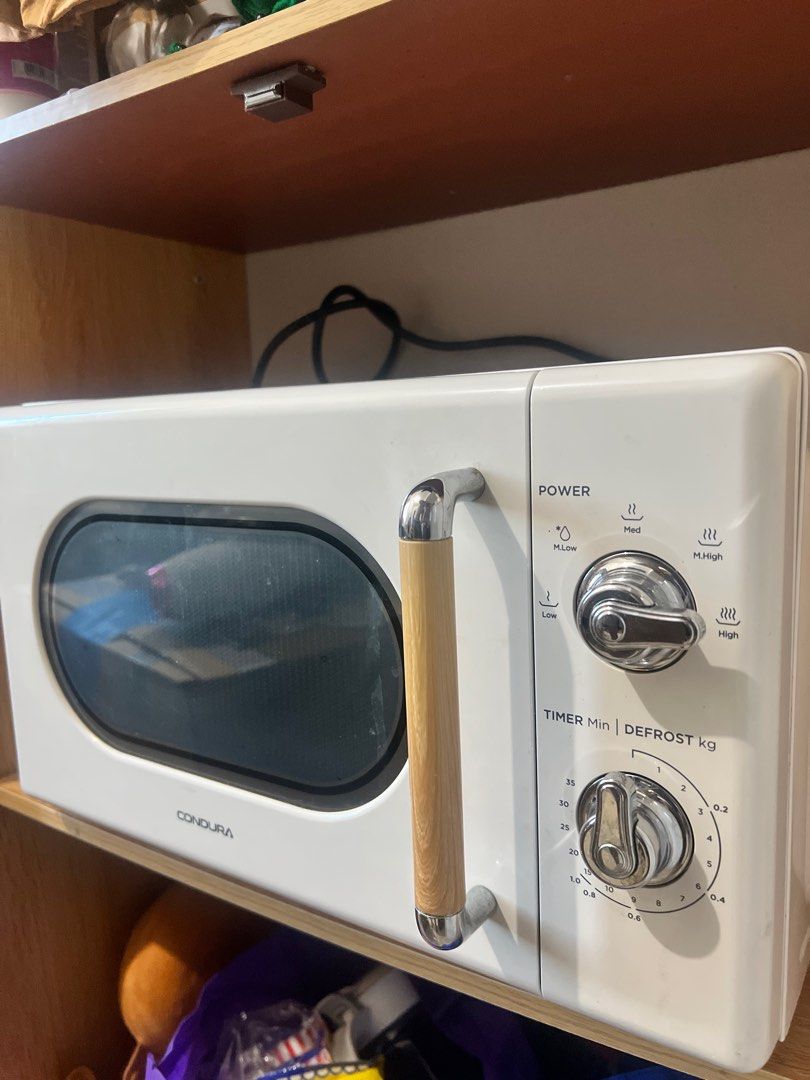 Condura Retro Microwave Oven (Category: Ovens & Toasters) located in Quezon City. Submitted by .red_ (Listing ID 1404459870, Image 2). Description: Condura Vintage Style 20L Microwave (Scandinavian White) ✔️ Working perfectly ✔️ Clean, well-kept, elegant vintage design ✔️ 20L capacity — great for daily heating & defrosting ✔️ Easy knob controls, compact, fits any kitchen Condition: 9/10 Price: P2,800 Fast replies. First come, first served!.