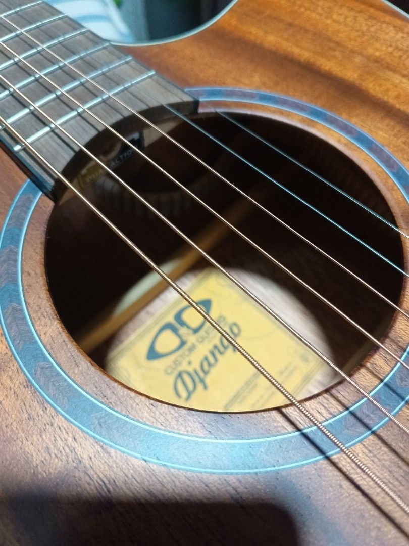 D&D Custom Guitars Acoustic Guitar Django Sr. (Category: Musical Instruments) located in Caloocan City. Submitted by royalfish_02affa (Listing ID 1404458097, Image 1). Description: D&D Custom Guitars acoustic guitar is a beautiful instrument. It features a natural wood finish and a cutaway design. The guitar comes with a case and is in its original packaging. The headstock has the D&D logo. The guitar has six strings and a rosewood fretboard. The