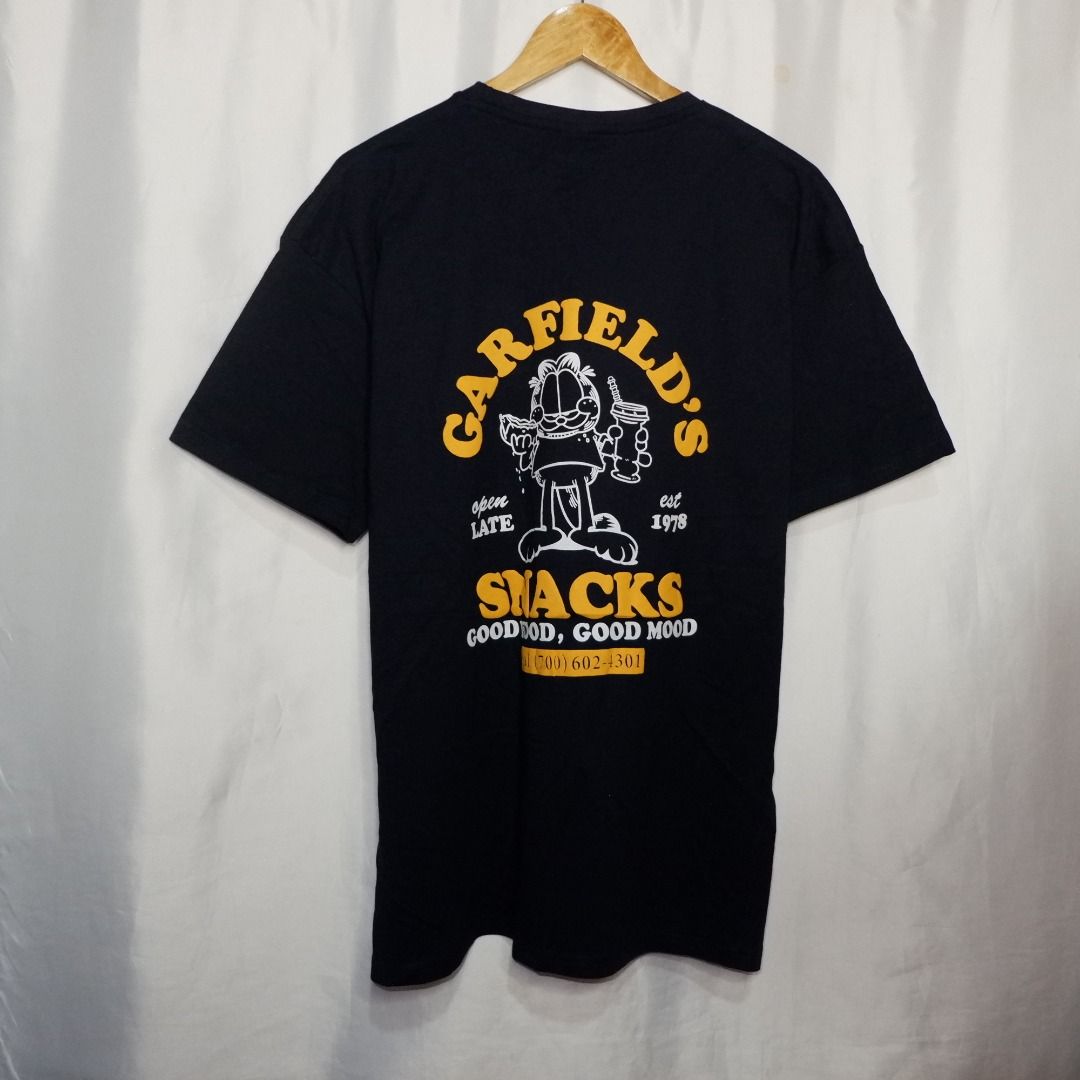 Garfield's Snacks T-shirt (Category: Tshirts & Polo Shirts ) located in Bacoor. Submitted by miladyph (Listing ID 1404402394, Image 1). Description: PB Garfield blue embossed prints backprint 2XL(1) 30"L 23"W.