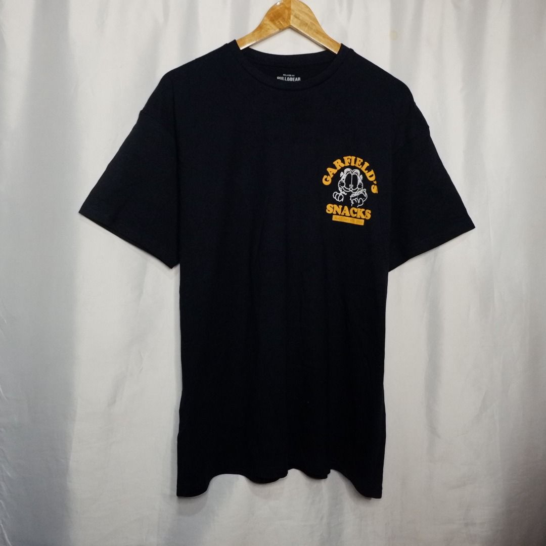 Garfield's Snacks T-shirt (Category: Tshirts & Polo Shirts ) located in Bacoor. Submitted by miladyph (Listing ID 1404402394, Image 2). Description: PB Garfield blue embossed prints backprint 2XL(1) 30"L 23"W.