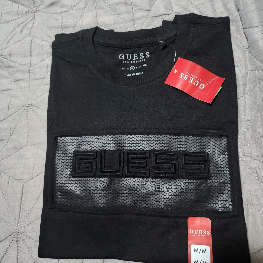 Guess Black T-shirt M/M (Category: Tshirts & Polo Shirts ) located in Manila. Submitted by zamken21 (Listing ID 1404520089, Image 3). Description: - Black Guess T-shirt - Size: M/M - Features a textured Guess logo - Classic crew neck design - Short sleeves - Unworn condition Brandnew Original Guess US Canada Size Large W20 L27.5 No Paper bag Manila area.