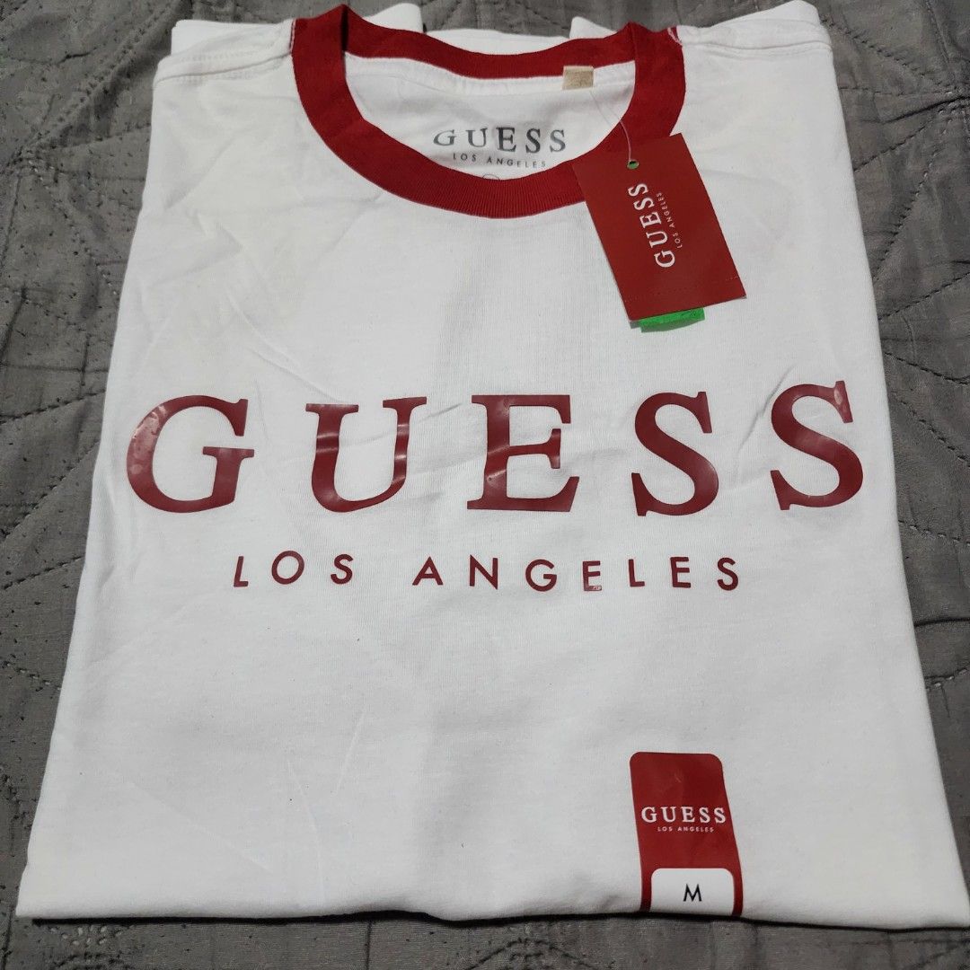Guess Los Angeles T-shirt - Medium (Category: Tshirts & Polo Shirts ) located in Manila. Submitted by zamken21 (Listing ID 1404519101, Image 2). Description: - Guess Los Angeles t-shirt - Red collar and accents - Guess logo on front - Size: Medium - Brand new with original tags Brandnew Original Guess US Canada Size Medium W20 L27.5 No Paper bag Manila area.