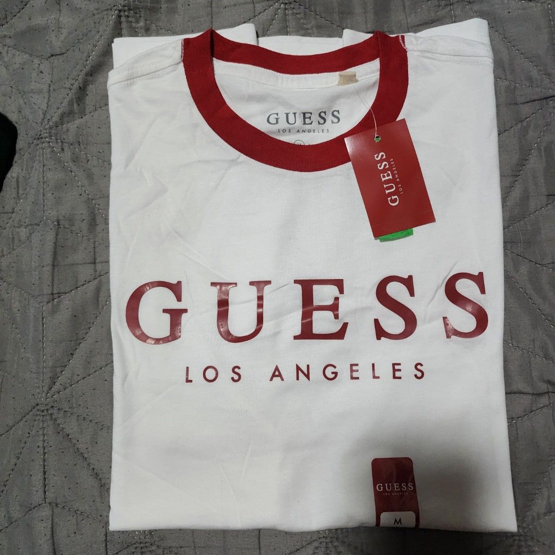 Guess Los Angeles T-shirt - Medium (Category: Tshirts & Polo Shirts ) located in Manila. Submitted by zamken21 (Listing ID 1404519101, Image 3). Description: - Guess Los Angeles t-shirt - Red collar and accents - Guess logo on front - Size: Medium - Brand new with original tags Brandnew Original Guess US Canada Size Medium W20 L27.5 No Paper bag Manila area.