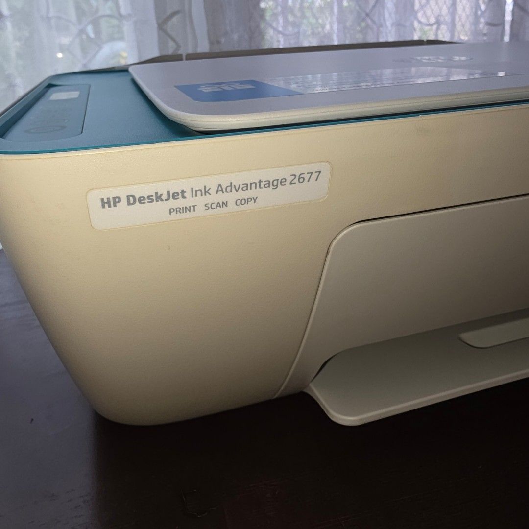 [WITH ISSUE] HP DESKJET INK ADVANTAGE 2677 Printer (Category: Printers, Scanners & Copiers) located in Bacoor. Submitted by xil10 (Listing ID 1404539587, Image 2). Description: HP DESKJET INK ADVANTAGE 2677 Print scan copy Cartridge code 680 blk/colored Color: White-blue Year: 2017-2018 Selling Php 500, no ink installed Scanner working. ISSUE: printing but feeder with issue. print output with lines. payment mode: bank transfer, gcash delivery: sh