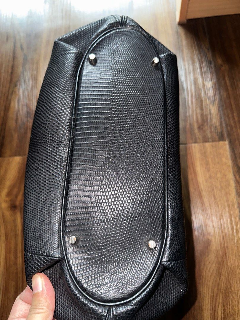 JRA Black Leather Handbag (Category: Luxury Bags & Wallets) located in Mandaluyong City. Submitted by TheWeekendProject (Listing ID 1404443721, Image 3). Description: - Black leather handbag - Textured exterior - Has its signature JRA metal tag - Two handles - Multiple compartments, including zippered pockets - Metal feet on the bottom - Well-constructed - 11” x 10” x 3.5”.