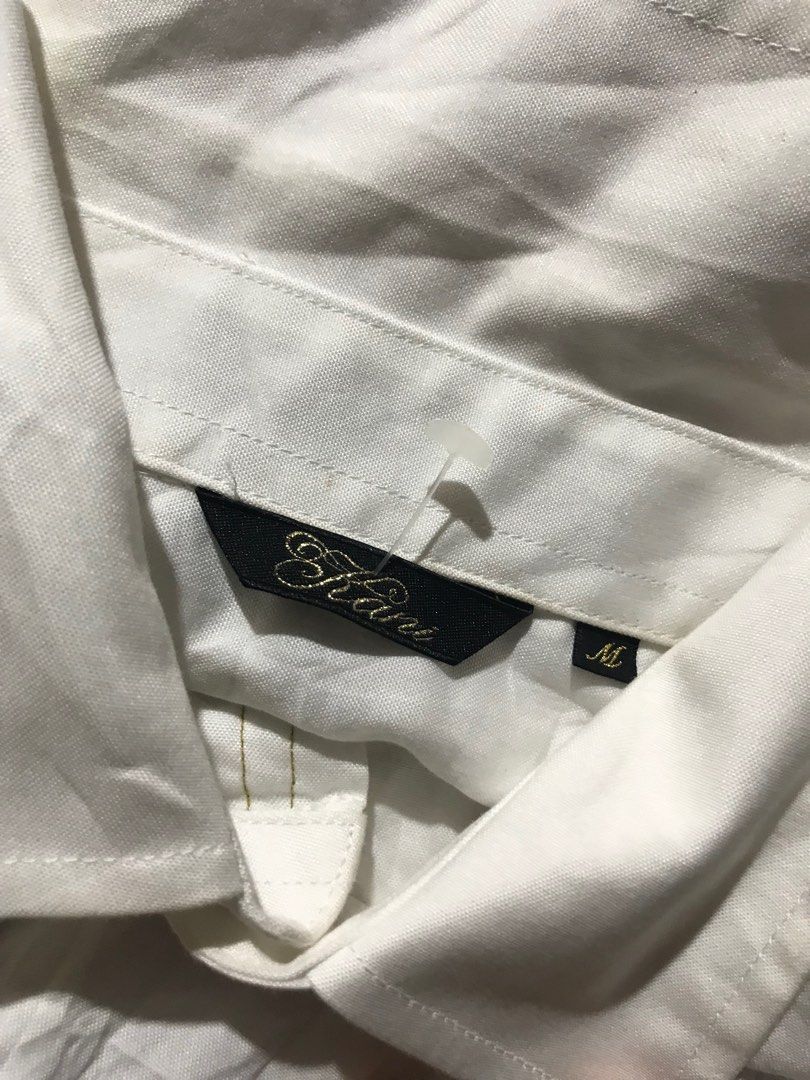 KARL KANI WHITE LONG SLEEVE (Category: Formal Shirts) located in Cagayan de Oro. Submitted by johnprom (Listing ID 1404535798, Image 2). Description: BAKA MAY LOOKING KARL KANI WHITE LONG SLEEVE ₱:300+SF L- 25 Front / 27 Back W- 17.5 -COLOR MAY DUE TO LIGHTING -GOOD CONDI -COOL DESIGN FLAWS: NEED WASH SIRA YUNG ISANG BUTTON (see last pic).