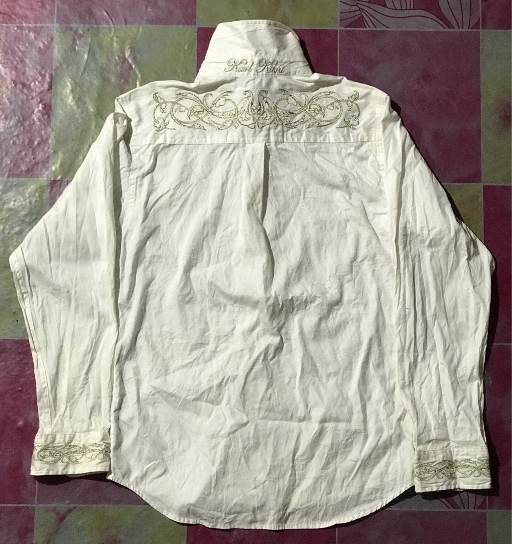 KARL KANI WHITE LONG SLEEVE (Category: Formal Shirts) located in Cagayan de Oro. Submitted by johnprom (Listing ID 1404535798, Image 3). Description: BAKA MAY LOOKING KARL KANI WHITE LONG SLEEVE ₱:300+SF L- 25 Front / 27 Back W- 17.5 -COLOR MAY DUE TO LIGHTING -GOOD CONDI -COOL DESIGN FLAWS: NEED WASH SIRA YUNG ISANG BUTTON (see last pic).