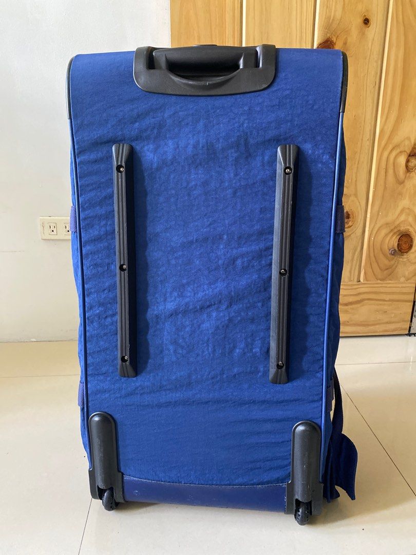 Kipling Teagan L Rolling Luggage - Ink Blue (Category: Backpacks) located in Silang. Submitted by ddeclutterproject (Listing ID 1404403834, Image 3). Description: - Kipling Teagan L rolling luggage - Color: Ink Blue - Features: - Multiple compartments - Retractable handle - Wheels for easy transport - Top handle - Shoulder straps - Interior lined with light-colored fabric - Lightly used, in original packaging *Light scratches at the bottom *Wheel