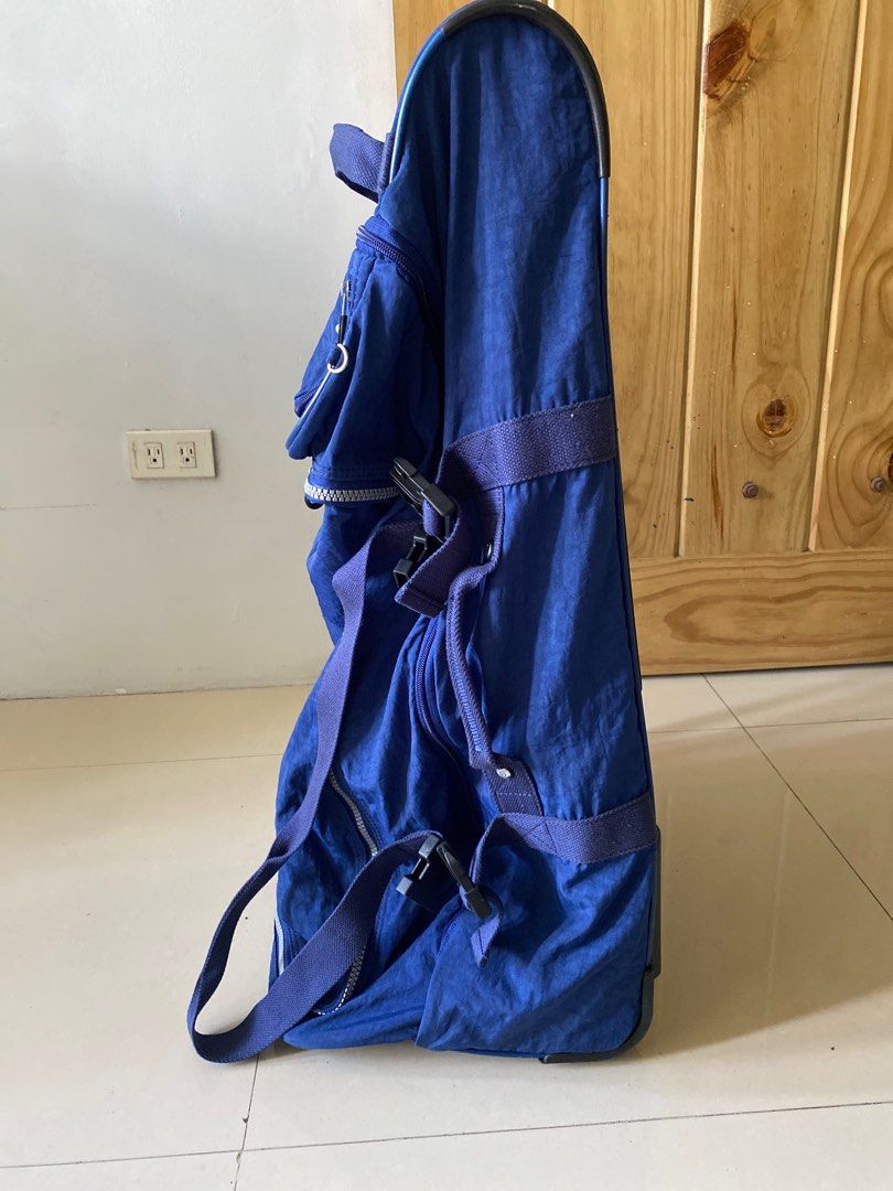 Kipling Teagan L Rolling Luggage - Ink Blue (Category: Backpacks) located in Silang. Submitted by ddeclutterproject (Listing ID 1404403834, Image 2). Description: - Kipling Teagan L rolling luggage - Color: Ink Blue - Features: - Multiple compartments - Retractable handle - Wheels for easy transport - Top handle - Shoulder straps - Interior lined with light-colored fabric - Lightly used, in original packaging *Light scratches at the bottom *Wheel