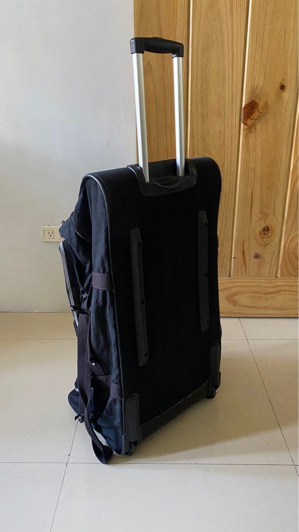 Kipling Trolley Bag (Category: Backpacks) located in Silang. Submitted by ddeclutterproject (Listing ID 1404400105, Image 2). Description: Preloved Original Teagan L Large Wheeled Duffle Bag by Kipling. PRODUCT DETAILS •2 zipped main compartments with: •Open mesh pocket •Zipped front pocket •Padded top carry handle •Side handles •Extendable top handle •Double carry handles with Velcro fasten •Round Kipling logo •Lightweight, lasting and always pr