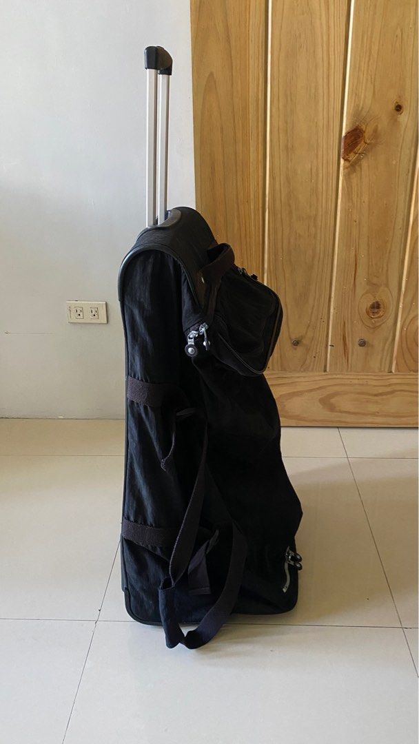 Kipling Trolley Bag (Category: Backpacks) located in Silang. Submitted by ddeclutterproject (Listing ID 1404400105, Image 3). Description: Preloved Original Teagan L Large Wheeled Duffle Bag by Kipling. PRODUCT DETAILS •2 zipped main compartments with: •Open mesh pocket •Zipped front pocket •Padded top carry handle •Side handles •Extendable top handle •Double carry handles with Velcro fasten •Round Kipling logo •Lightweight, lasting and always pr