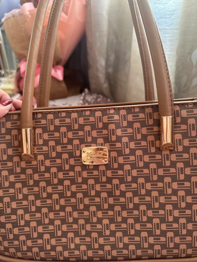 Brown Patterned Shoulder Bag/Sling Bag (Category: Shoulder Bags) located in Paranaque City. Submitted by moonbea (Listing ID 1404409193, Image 2). Description: Still brand new Bought it from Landmark Makati Good for office use or formal events Original Price: 899 .