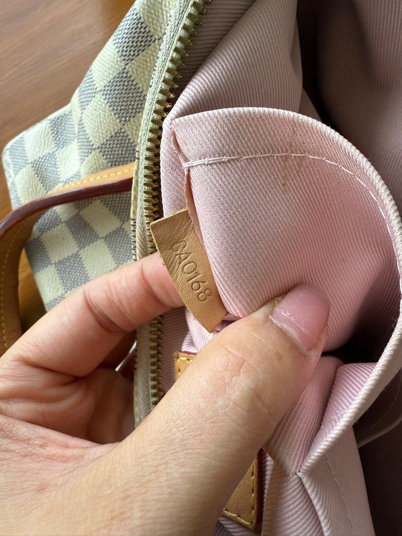 Louis Vuitton Damier Azur Canvas Handbag (Category: Luxury Bags & Wallets) located in Iloilo. Submitted by imnolittlej (Listing ID 1404442211, Image 2). Description: - Authentic Louis Vuitton Damier Azur handbag - Zip closure - Interior pockets - Detachable shoulder strap - Includes two leather tassels - Includes provided dust bag - Light pink interior lining - Gold-toned hardware - Date code: SD0168.
