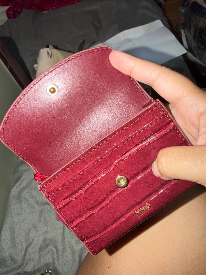 Mango Croc-Effect Wallet (Category: Wallets & Card holders) located in Taguig. Submitted by megdeclutter (Listing ID 1404556942, Image 3). Description: - Mango croc-effect wallet - Deep red color - Snap closure - Multiple card slots - Compact design - Zippered coin compartment - Mango logo detail.