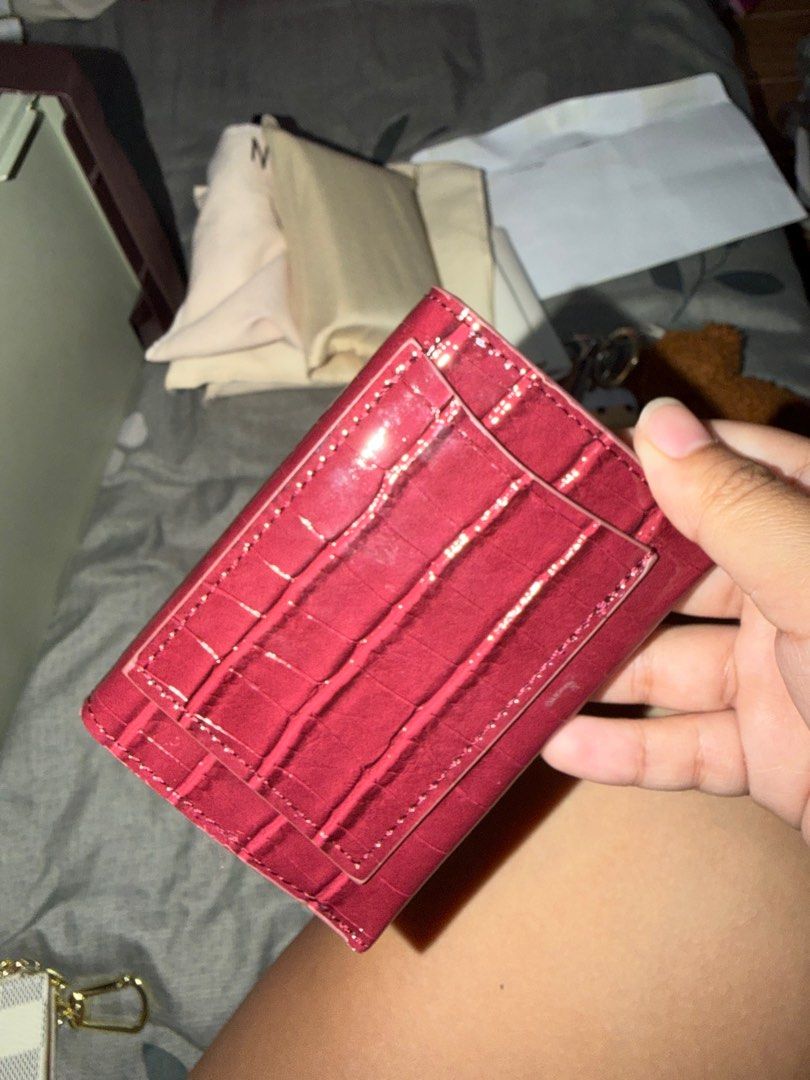 Mango Croc-Effect Wallet (Category: Wallets & Card holders) located in Taguig. Submitted by megdeclutter (Listing ID 1404556942, Image 2). Description: - Mango croc-effect wallet - Deep red color - Snap closure - Multiple card slots - Compact design - Zippered coin compartment - Mango logo detail.