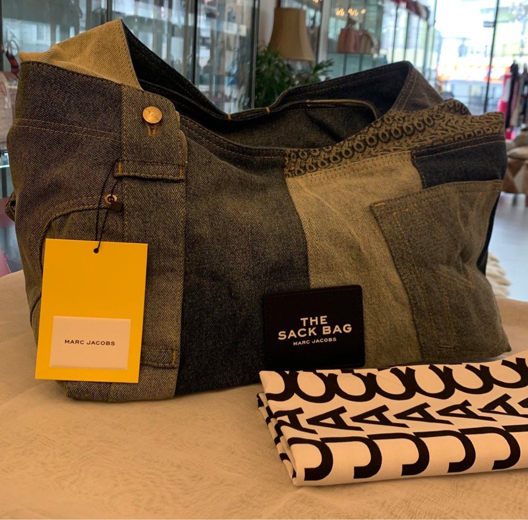Marc Jacobs The Sack Bag Denim Handbag (Category: Luxury Bags & Wallets) located in Quezon City. Submitted by hush_lowkey (Listing ID 1404414038, Image 3). Description: - Authentic Marc Jacobs handbag - Unique denim patchwork design - Includes matching pouch - Comes with dust bag - Features a top handle - Medium size.
