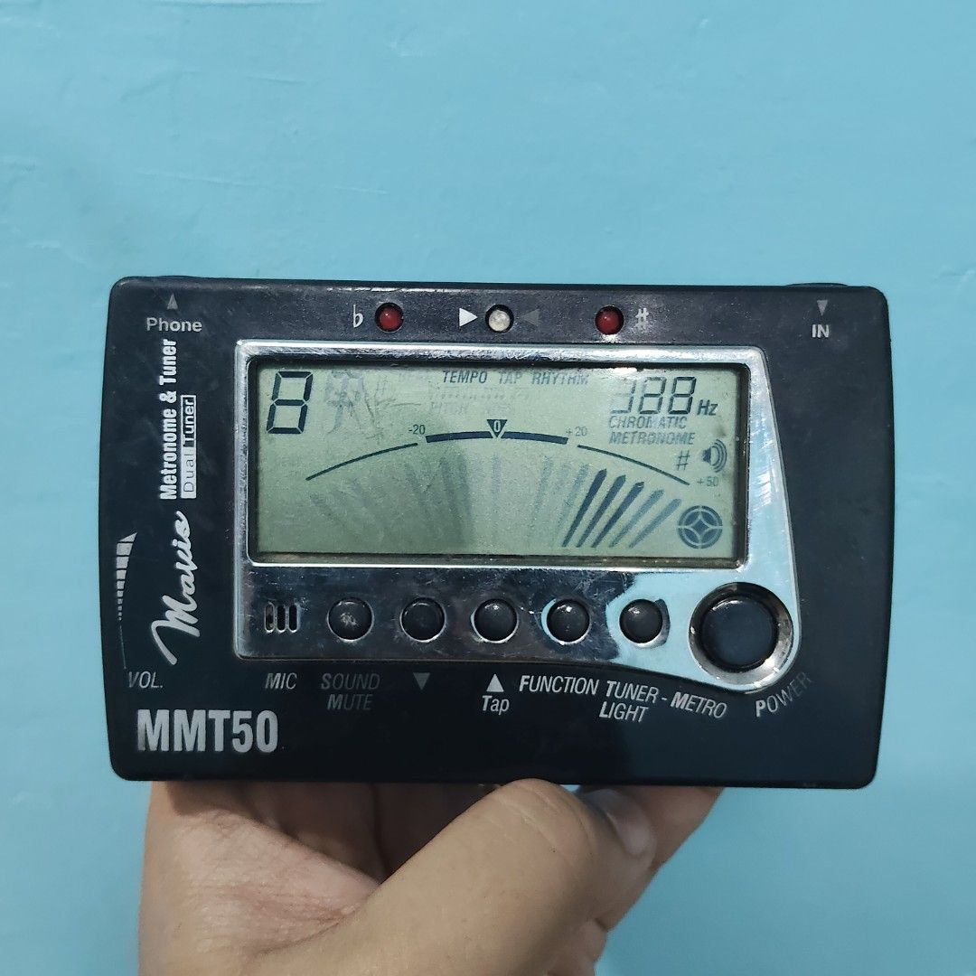 Mavis MMT50 Tuner & Metronome (Category: Musical Instruments) located in Catbalogan. Submitted by jpnsrpls (Listing ID 1404542609, Image 2). Description: Mavis MMT50 Tuner & Metronome (Japan Surplus) 2-in-1 Essential: Chromatic Tuner & Metronome combo unit. Versatile: Works for guitar, bass, violin, and most other instruments. Features: Bright LCD, built-in mic/speaker, tap tempo function. Condition: Reliable Japan surplus, tested & working great