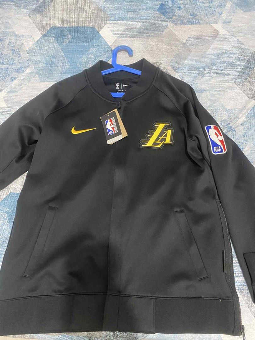 Nike Los Angeles Lakers NBA Jacket (Category: Coats, Jackets and Outerwear) located in Taytay. Submitted by zipzyzan (Listing ID 1404511588, Image 1). Description: - Official Nike Los Angeles Lakers jacket - Features Lakers logo on front - "LOS ANGELES LAKERS" printed on the back - Includes NBA logo patch - Made with Dri-FIT technology - Full zip closure - Two front pockets - Made in Thailand Lakers NBA Jacket and Jogger package 9,999 Per pc pric