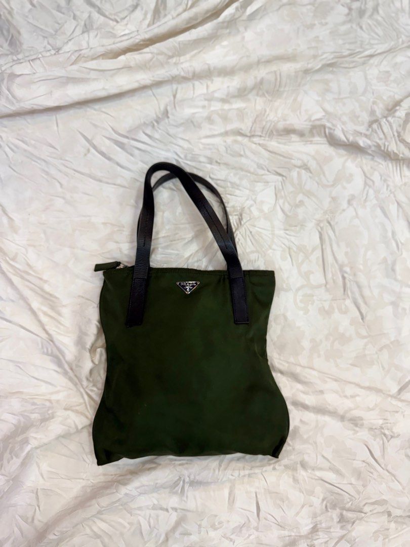 Prada Mini Hand Bag Nylon (Category: Luxury Bags & Wallets) located in Manila. Submitted by fivethousandlilies (Listing ID 1404551993, Image 1). Description: Guaranteed authentic Vintage good condition Can fit phone but not folding umbrella so its mini and cute Pm for more info.