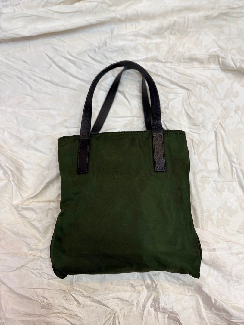 Prada Mini Hand Bag Nylon (Category: Luxury Bags & Wallets) located in Manila. Submitted by fivethousandlilies (Listing ID 1404551993, Image 2). Description: Guaranteed authentic Vintage good condition Can fit phone but not folding umbrella so its mini and cute Pm for more info.