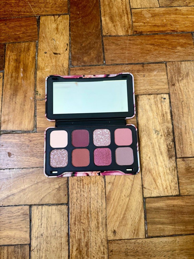 Revolution Forever Dynamic Allure Eyeshadow Palette (Category: Makeup) located in San Juan City. Submitted by bel2025 (Listing ID 1404372156, Image 1). Description: - Revolution eyeshadow palette - Features pink, purple, and neutral shades - Includes a mirror - Contains 8 eyeshadow colors - Ingredient information on the back - Compact and travel-friendly.
