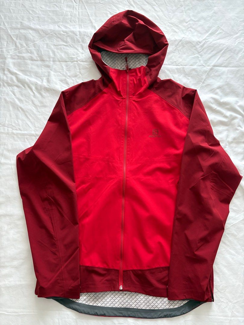Salomon Red Hooded Rain Jacket - Size L (Category: Coats, Jackets and Outerwear) located in Manila. Submitted by clearspaceshop (Listing ID 1404409384, Image 1). Description: Size: L Color: Two tones of reds Performance Rain Jacket with Advanced Skin Dry Technology Never used (bought the wrong size) Ventilation openings on the side Two waterproof pockets Hood for maximum protection .