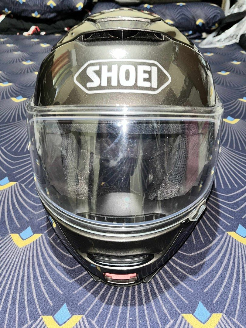 Shoei Neotec II Modular Helmet (Category: Helmets and other Riding Gears) located in Antipolo. Submitted by buy1buy4ll (Listing ID 1404498475, Image 1). Description: - Shoei Neotec II modular helmet - Metallic grey color - Includes original Shoei helmet bag - Clear visor - Flip-up design - Medium - Prestine condition - 18,000 Pick up in Cainta at buyer’s expense - Shoei logo on front and rear.