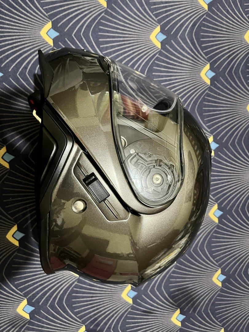 Shoei Neotec II Modular Helmet (Category: Helmets and other Riding Gears) located in Antipolo. Submitted by buy1buy4ll (Listing ID 1404498475, Image 3). Description: - Shoei Neotec II modular helmet - Metallic grey color - Includes original Shoei helmet bag - Clear visor - Flip-up design - Medium - Prestine condition - 18,000 Pick up in Cainta at buyer’s expense - Shoei logo on front and rear.