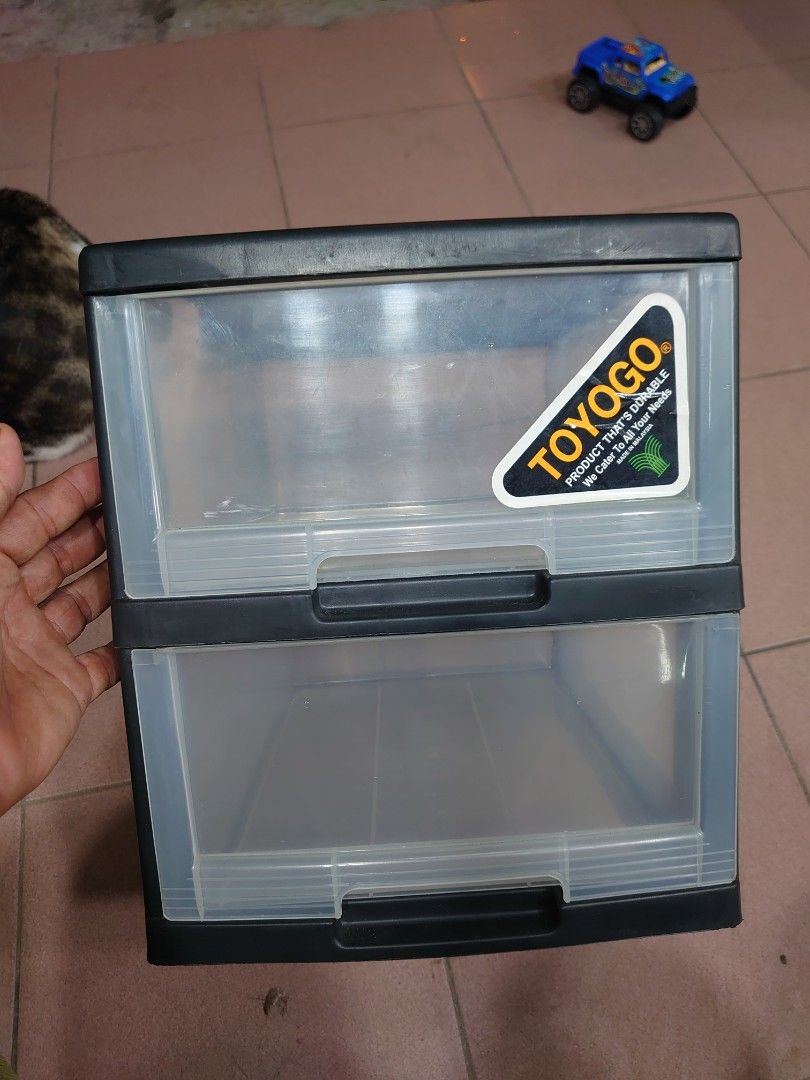 Toyogo 2-Tier Storage Drawer (Category: Shelves, Cabinets & Racks) located in Simpang Rengam. Submitted by gerobokkarat (Listing ID 1404522849, Image 1). Description: - Toyogo 2-tier storage drawer - Features two clear plastic drawers - Black frame - Textured top surface - Suitable for various items - Ideal for home or office storage.