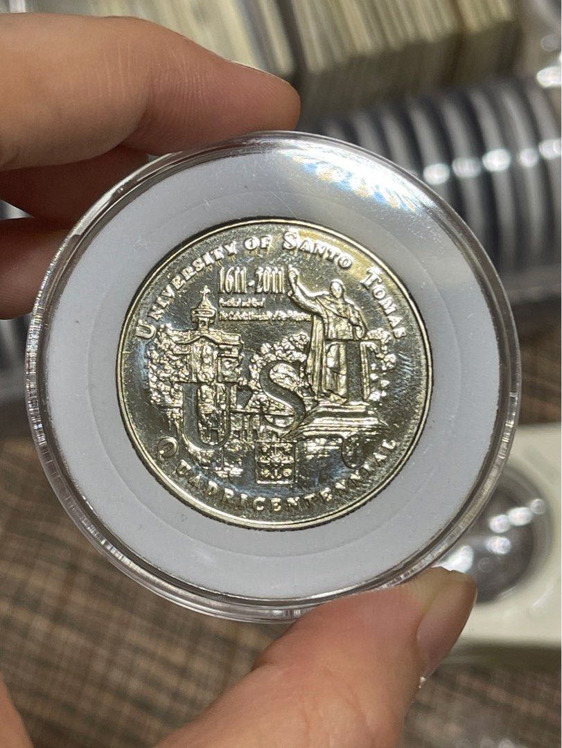 UST Quadricentennial Medal (Category: Currency) located in Manila. Submitted by banene_poteto (Listing ID 1404504051, Image 1). Description: Have acid test on the back. See picture. .