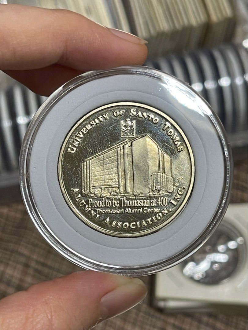 UST Quadricentennial Medal (Category: Currency) located in Manila. Submitted by banene_poteto (Listing ID 1404504051, Image 2). Description: Have acid test on the back. See picture. .