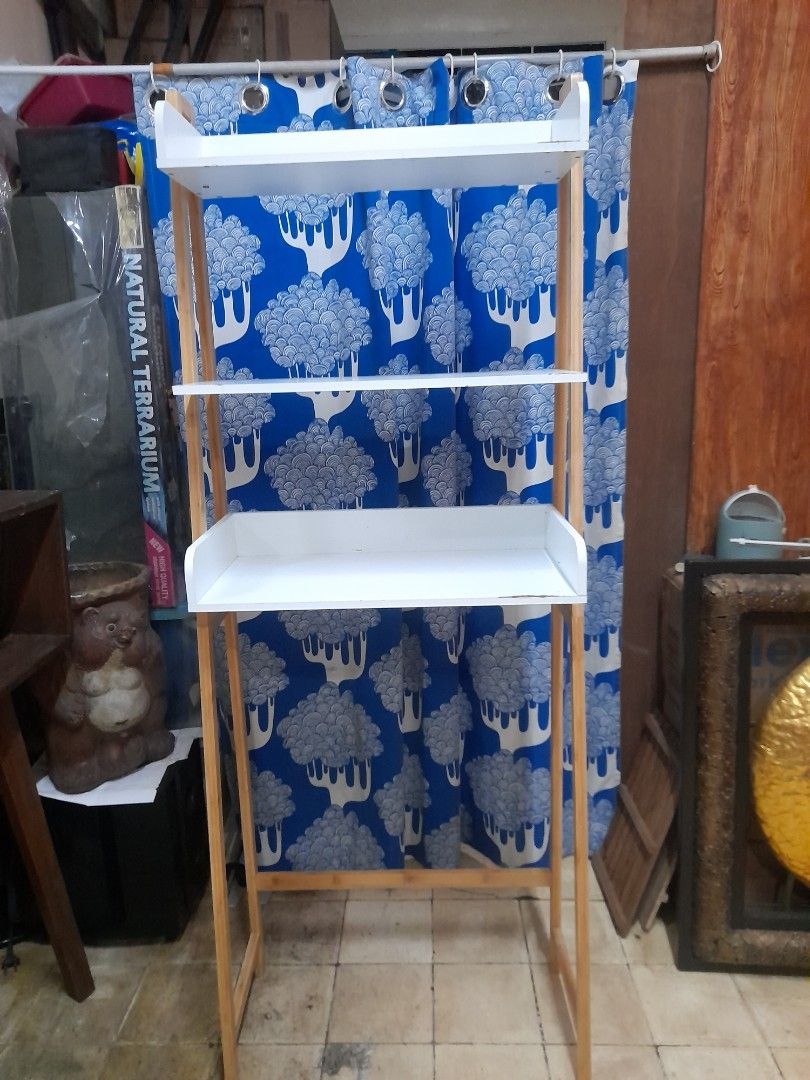 Wooden Shelf white (Category: Shelves, Cabinets & Racks) located in Valenzuela. Submitted by newbear.425b6e (Listing ID 1404530056, Image 1). Description: - Wooden shelf with a natural wood finish. - japan surplus - Features a blue curtain with a sheep pattern. - Designed for storage or display. - Simple and functional design..