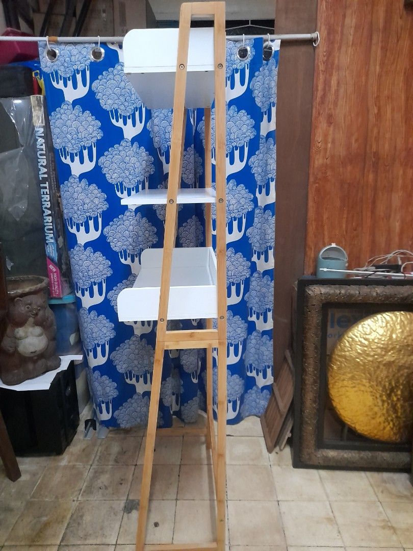 Wooden Shelf white (Category: Shelves, Cabinets & Racks) located in Valenzuela. Submitted by newbear.425b6e (Listing ID 1404530056, Image 2). Description: - Wooden shelf with a natural wood finish. - japan surplus - Features a blue curtain with a sheep pattern. - Designed for storage or display. - Simple and functional design..
