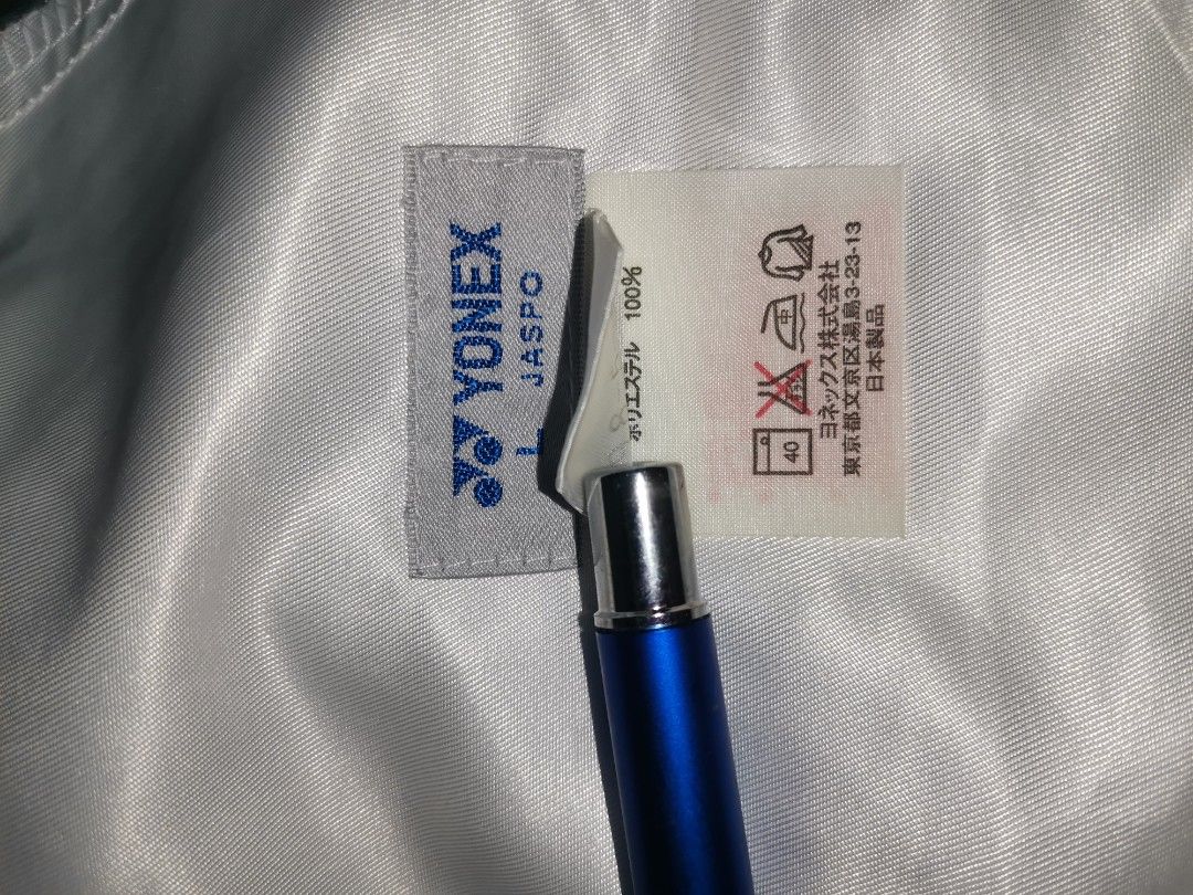 Yonex Track Pants - White and Navy (Category: Joggers) located in San Pablo. Submitted by somariaj (Listing ID 1404443312, Image 2). Description: - Yonex track pants - Color: White with navy blue side stripes - Features: Front zipper, elastic waistband - Material: 100% polyester - Visible Yonex logo - JASPO product 26-36x41.