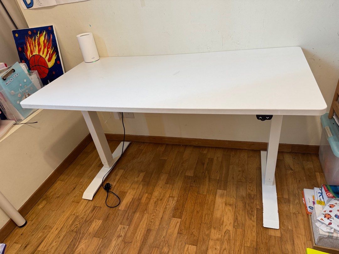 Adjustable table (Category: Tables & Sets) located in Singapore. Submitted by rinchenhs (Listing ID 1404583274, Image 1). Description: 140cm x 80cm and adjustable height. Self collect .