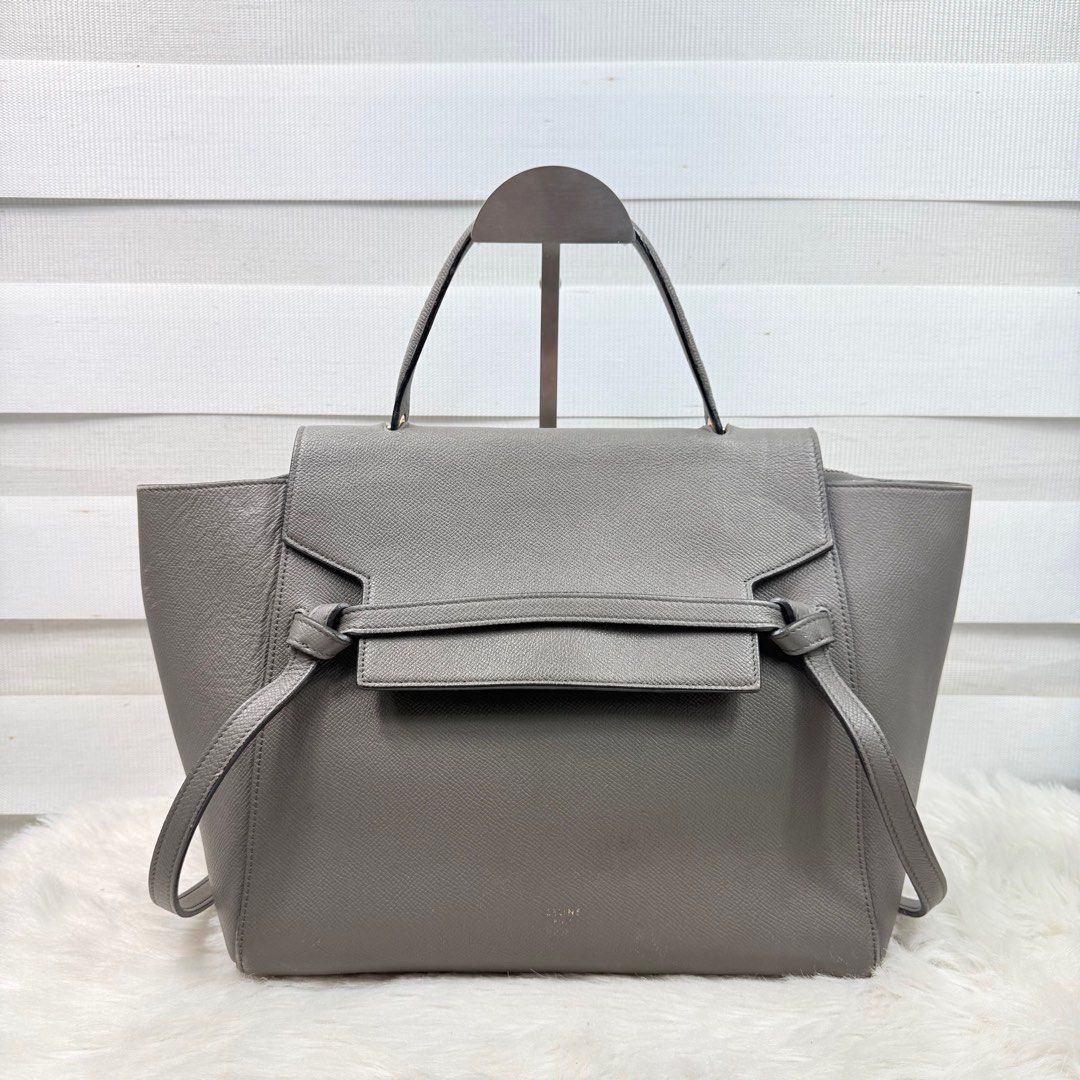 Authentic Celine Belt Bag (Category: Luxury Bags & Wallets) located in Pasig City. Submitted by trendapparelph (Listing ID 1404738005, Image 1). Description: - Celine Belt Bag in grey - Top handle and shoulder strap (No strap) - Flap closure with belt detail - Interior zippered pocket - Gold-toned hardware - Made in Italy.