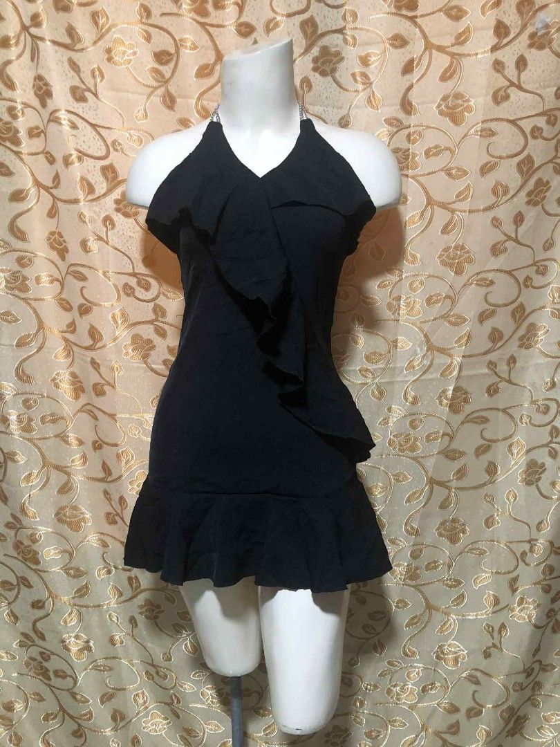 Black Halter Dress with Ruffles (Category: Dresses) located in Cavite. Submitted by virginiacubero08 (Listing ID 1404600595, Image 2). Description: - Black halter neckline dress - Features ruffle detail - Fitted bodice - Flared skirt with ruffle hem - Made of soft fabric - Back zipper closure - Perfect for special occasions.