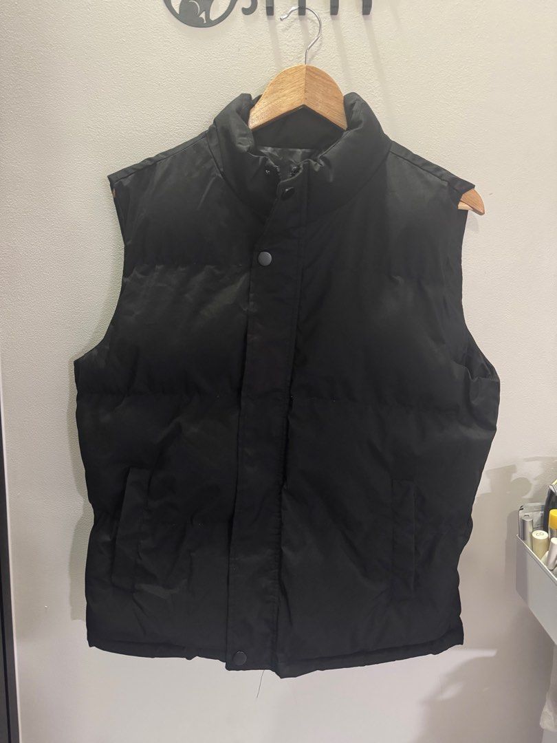 Black puffer vest (Category: Coats, Jackets and Outerwear) located in Bulacan. Submitted by operationdeclutter96 (Listing ID 1404607656, Image 1). Description: Only used once during winter trip in Japan For men. bought in japan.
